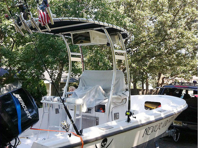 1975 Mako center console boat with universal ttop by Stryker T-Tops installed