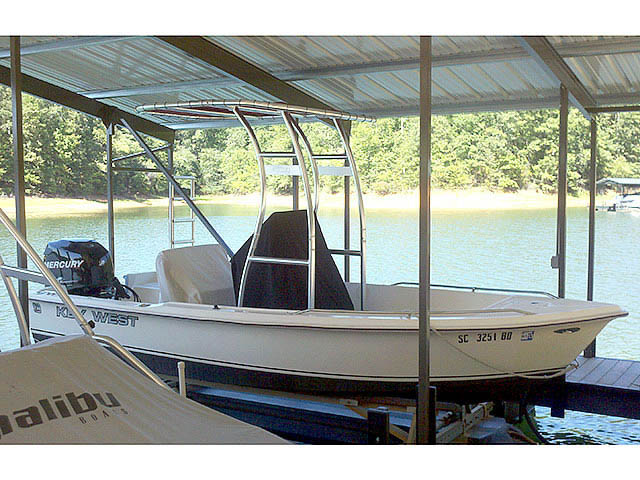 1998 1720 Key West center console boat with universal ttop by Stryker T-Tops installed