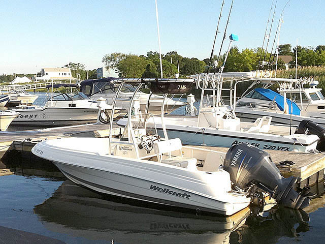 Wellcraft center console boat with universal ttop by Stryker T-Tops installed